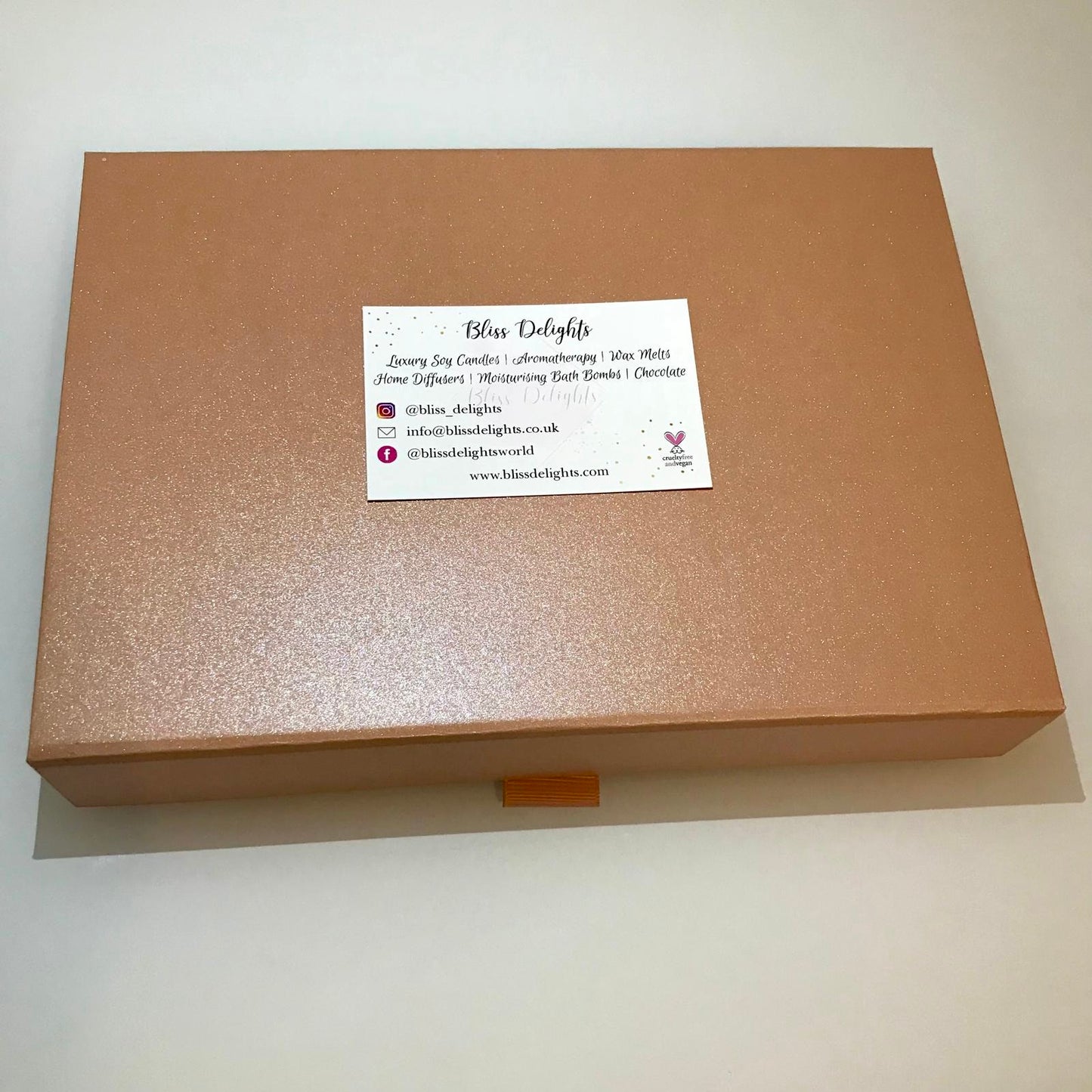 Brown box with a business card on a white background