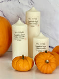 Three cream-coloured Bliss Delights Velvet Rose & Oud soy wax pillar candles in small, medium and large sizes, displayed against a white marble background.
